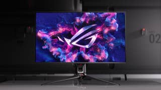 Asus ROG Swift OLED PG32UCDM monitor sitting on a desk with some cool stuff on the screen