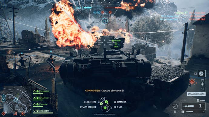 A screenshot of Battlefield 6, showing a tank rolling through a destroyed village, a shell exploding in front of it.