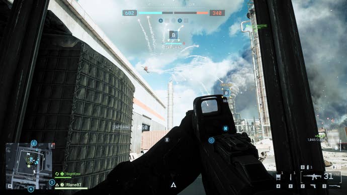 A screenshot of Battlefield 6, showing the player crouching in the window of a building. Overhead, a helicopter launches flare countermeasures to avoid a missile strike.