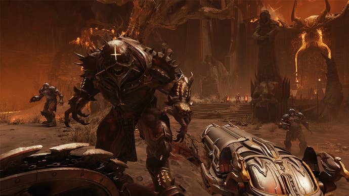 A first-person view in Doom: The Dark Ages, showing the player holding a double barrelled weapon and approaching a large, demon-like enemy.