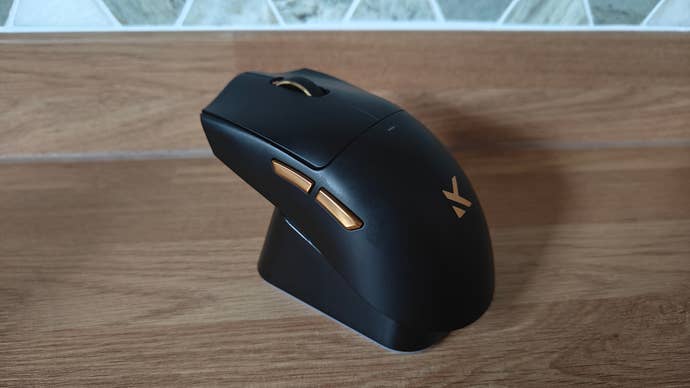 Mchose K7 Ultra on its charging stand