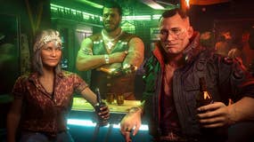 Three gruff-looking people at a neon-lit bar turn to face the camera. One is an older lady, one is a burly barman with their arms crossed, and one is a chunky leather jacket-wearing, broad-faced thug of a guy, with a beer in their hand. It's Jackie Welles from Cyberpunk 2077.