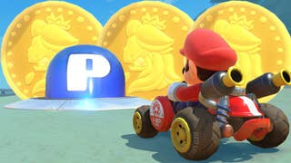 Mario driving a kart towards a blue P Switch with golden Peach Medallions behind it