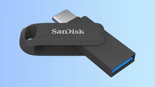 SanDisk Ultra Dual Drive Go flash drive in black on a gradient background