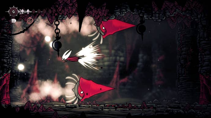 Hornet dashes over the Great Conchflies as they charge horizontally across the arena in Hollow Knight: Silksong