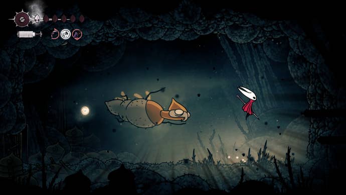 Hornet jumps away from one of the Broodmother's charge and slam attacks in Hollow Knight: Silksong