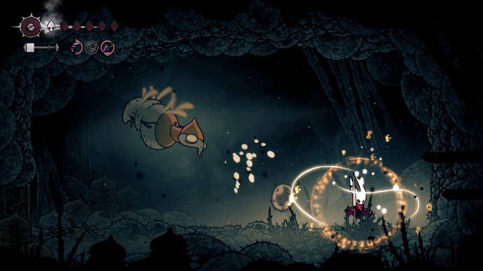 Hornet Binds while Broodmother fires a slime projectile at her in Hollow Knight: Silksong